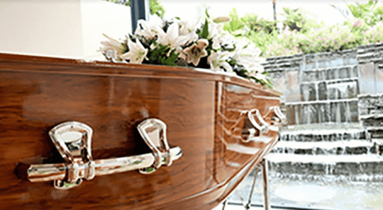 A coffin with flowers